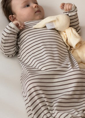 4 month old baby wearing deluxe merino stripe gown in cocoa stripe