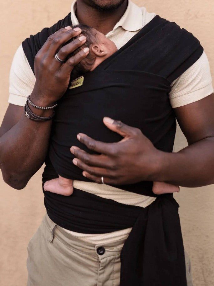 Dad wearing baby in a Black Boba Wrap 