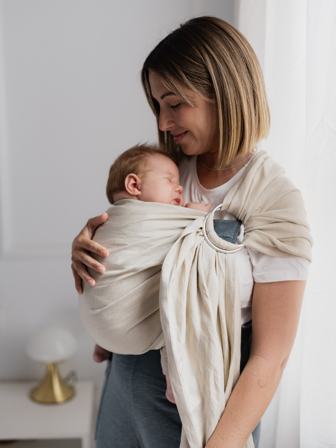 Mum wearing baby in a linen ring sling
