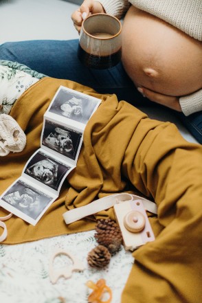 expecting woman with Boba wrap and basket set up