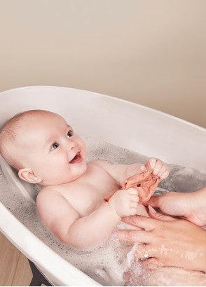 Baby smiling in bath