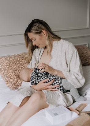 Mum breastfeeding baby with Lila jasmine lactation support bars