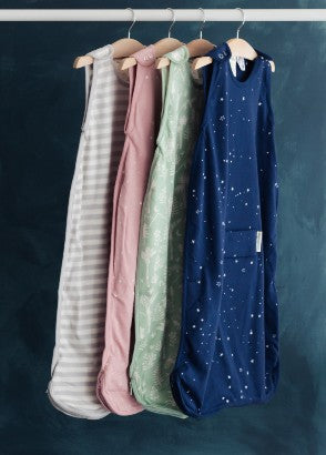 Row of Woolbabe mini 3 seasons sleeping bags hanging on rail