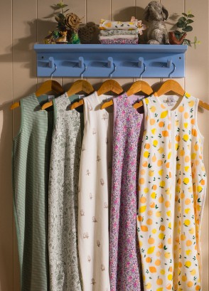 The sleep store premium organic cotton 0.2 tog sleeping bags hanging on a rack