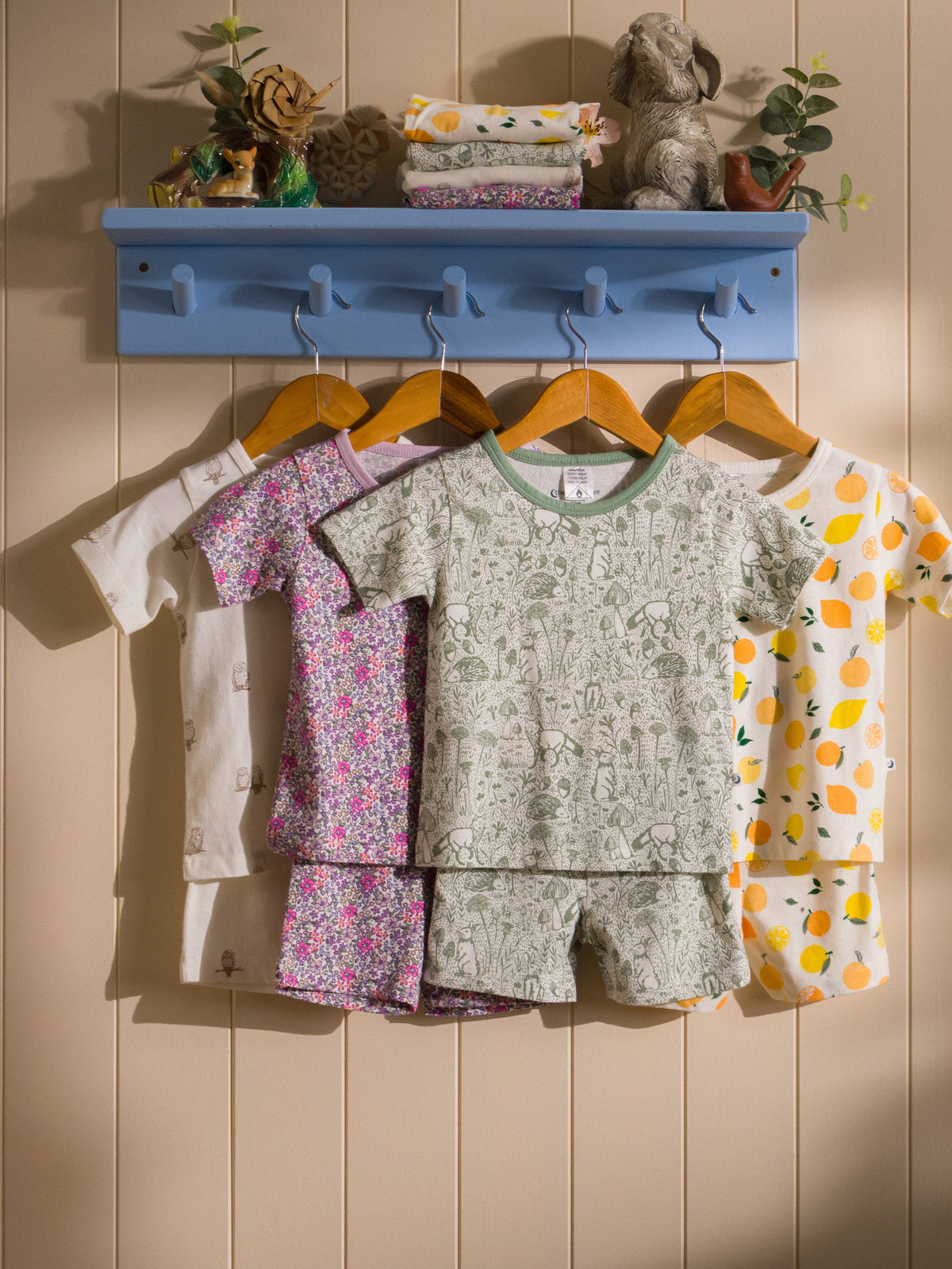 Row of short sleeve summer pjs hanging on a rack