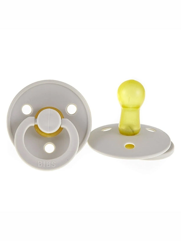 two white Bibs dummies