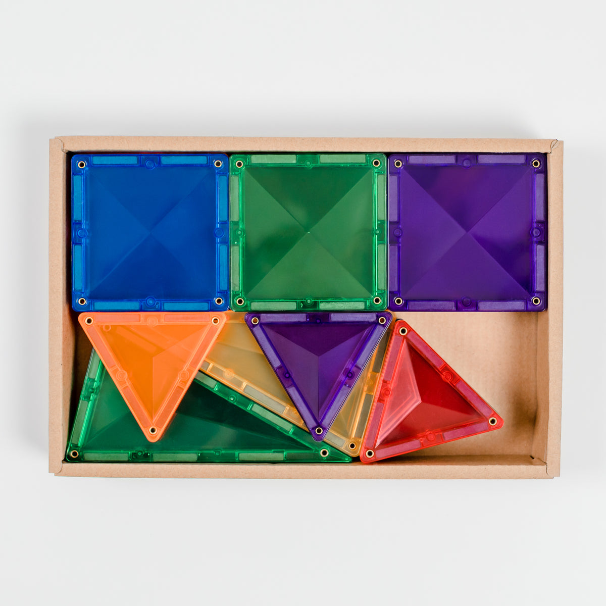Colorful Connetix geometric building blocks in a wooden box on a white background
