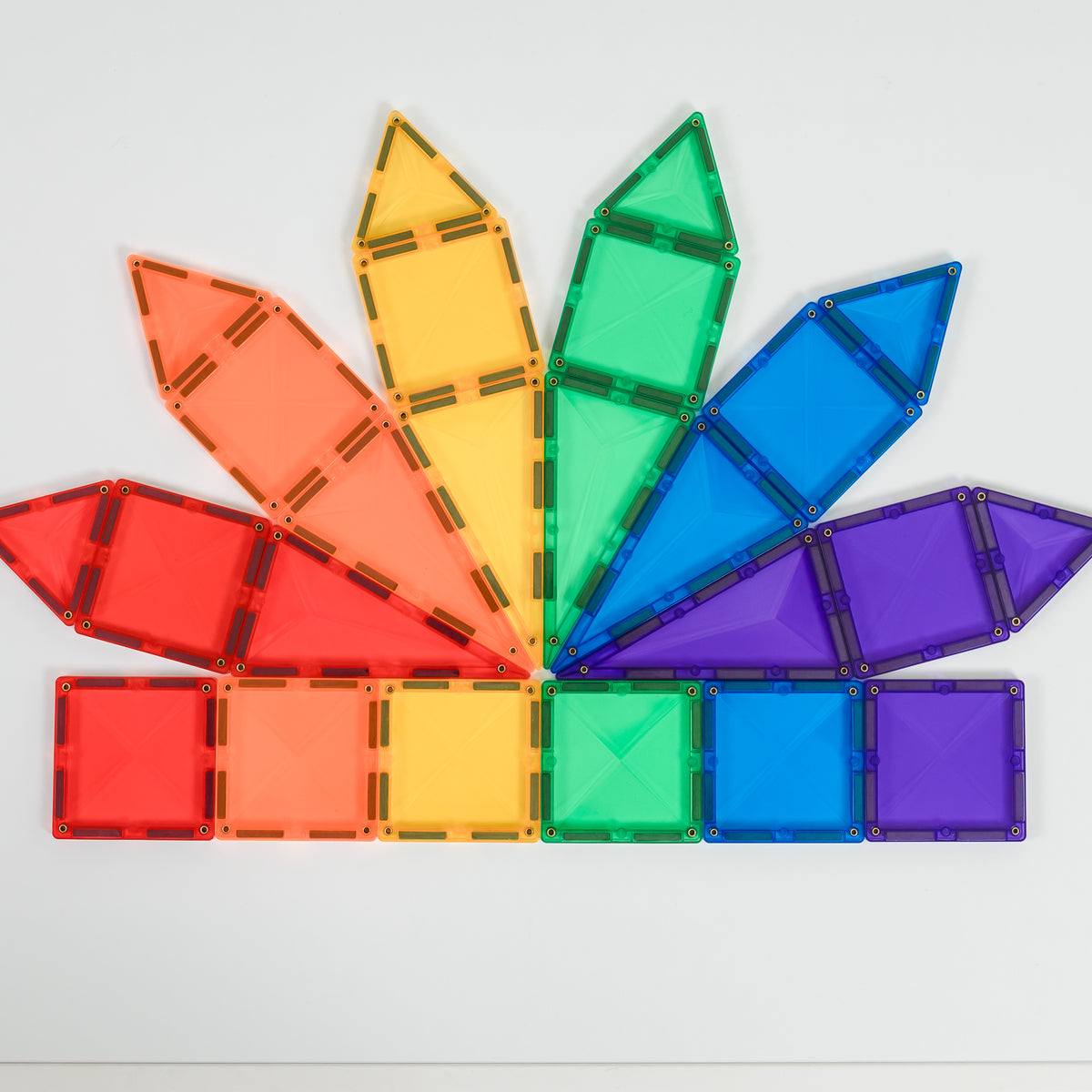 Colorful magnetic building blocks arranged in a fan-like pattern on a light gray background