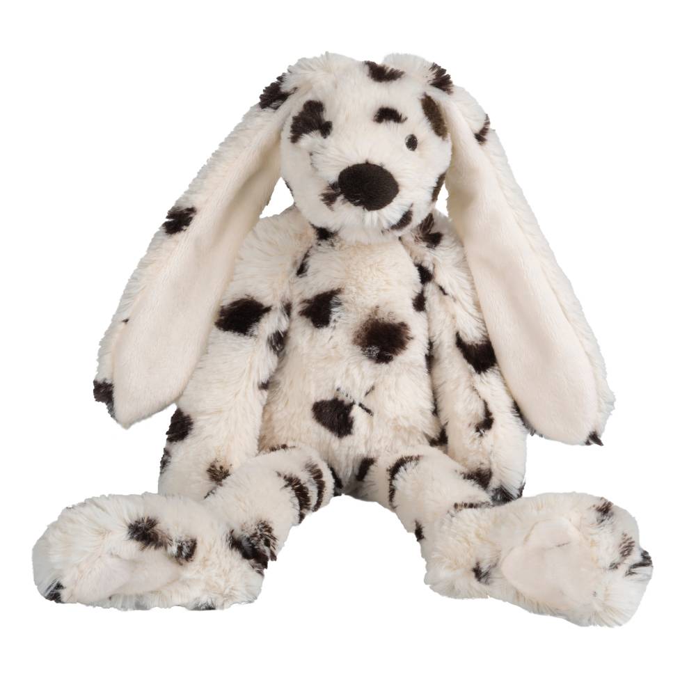 White plush bunny toy with black spots on a white background