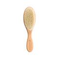 Wooden toddler baby brush with natural bristles on a white background
