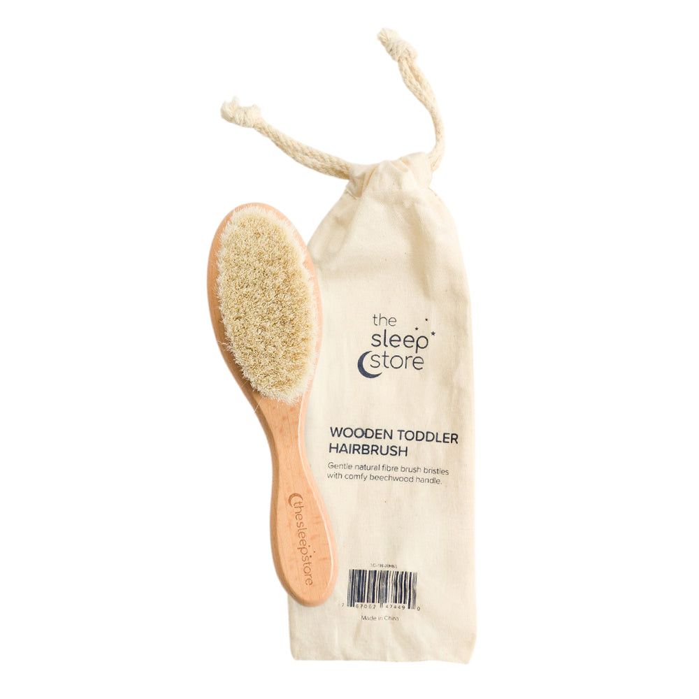 Sleep Store beechwood toddler hairbrush with natural bristles with small cloth storage bag on white background