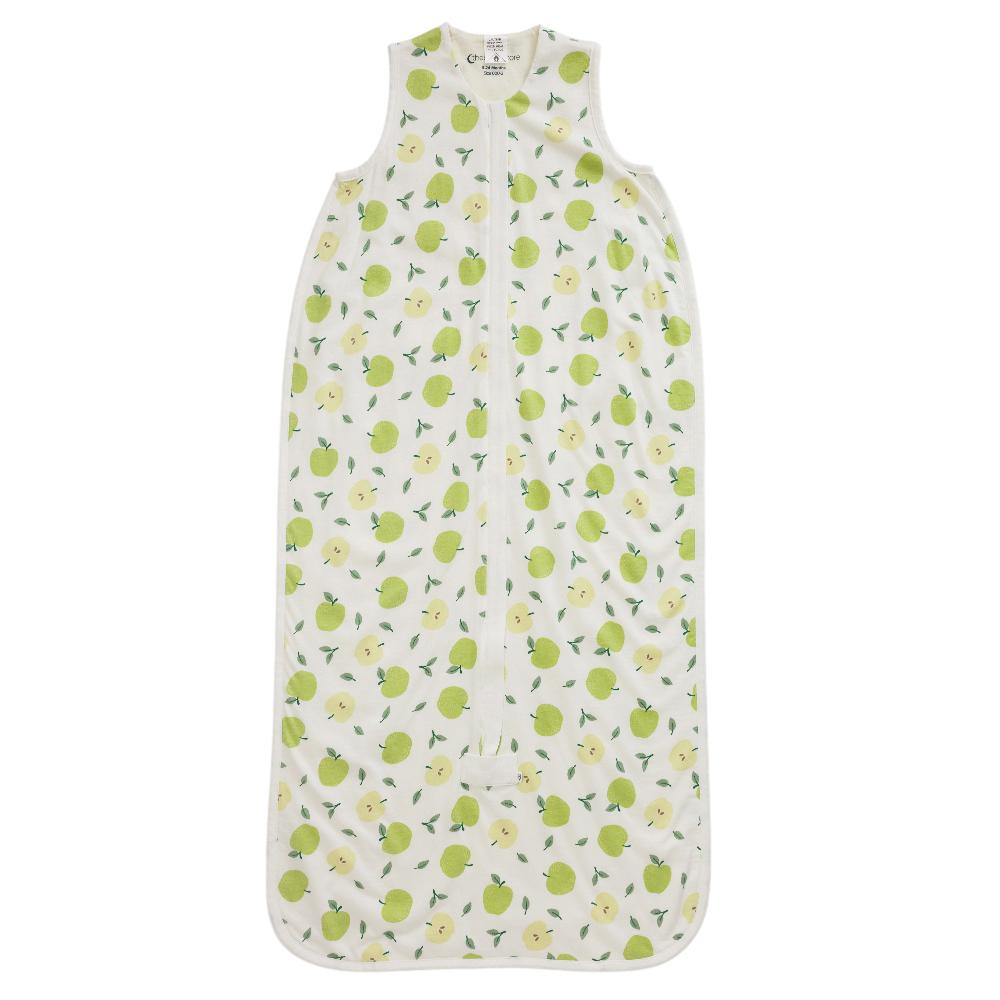 Cotton sleeping bag with green apple print on a white background