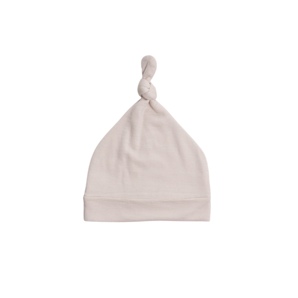 Cream Merino Knotted beanie on a white background