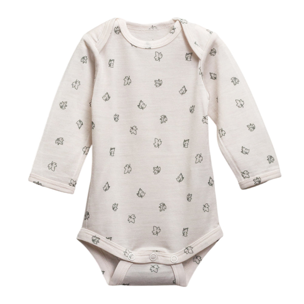 Cream with leaf print merino long sleeve bodysuit on a white background
