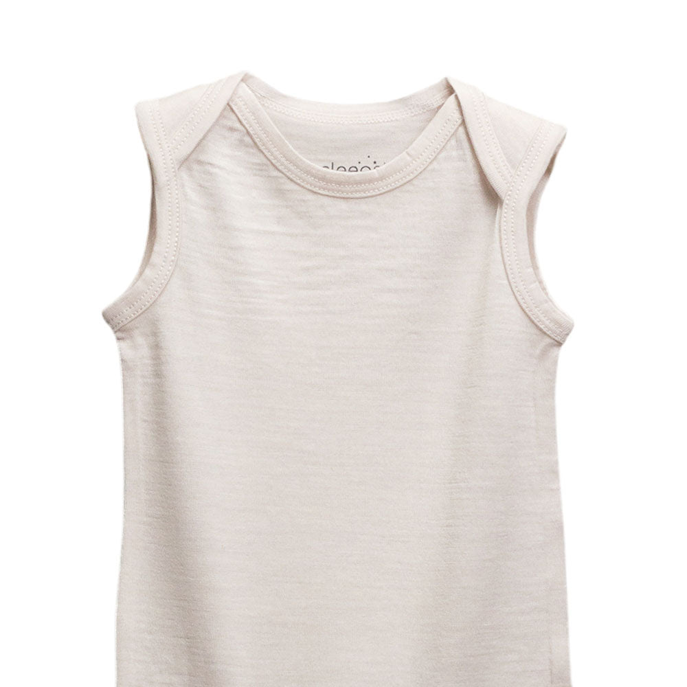 A sleeveless baby tank top in a light cream or off-white color, shown against a plain white background.