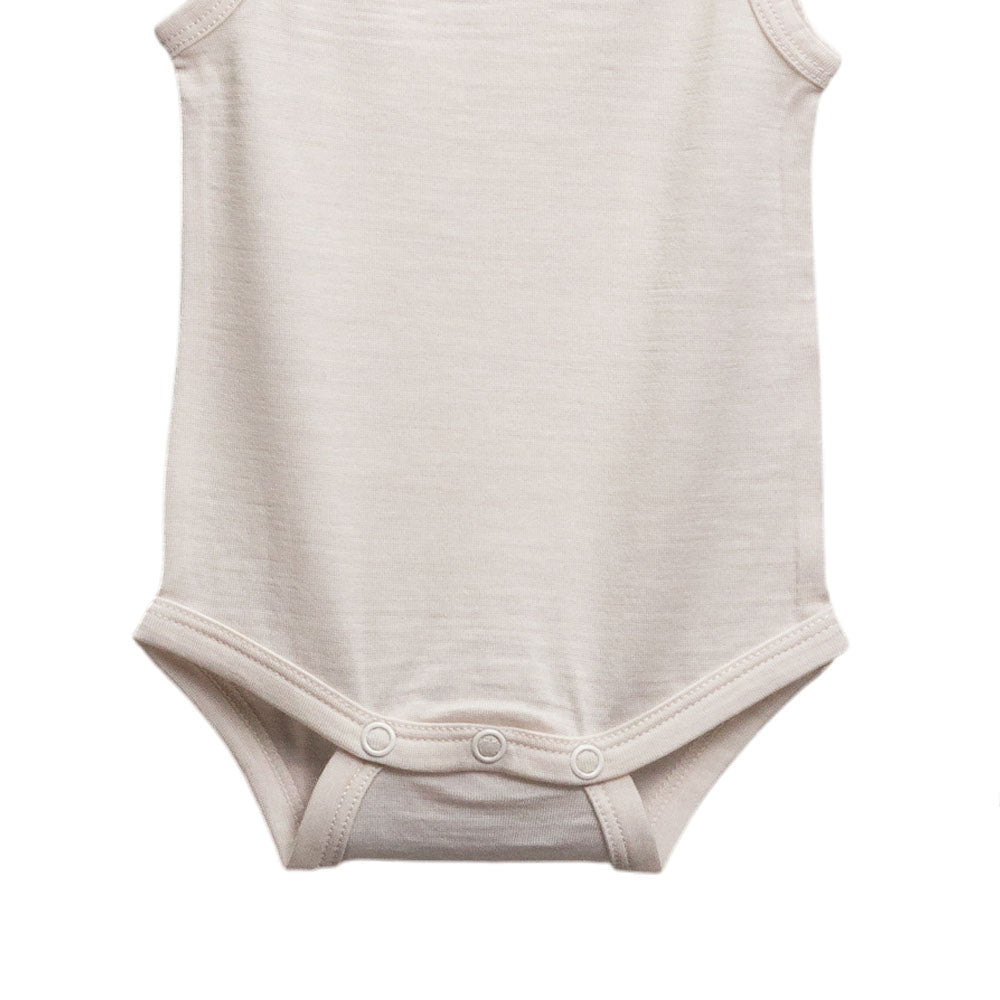 A sleeveless baby bodysuit in a light cream or off-white color, featuring three snap buttons at the crotch, shown against a plain white background.