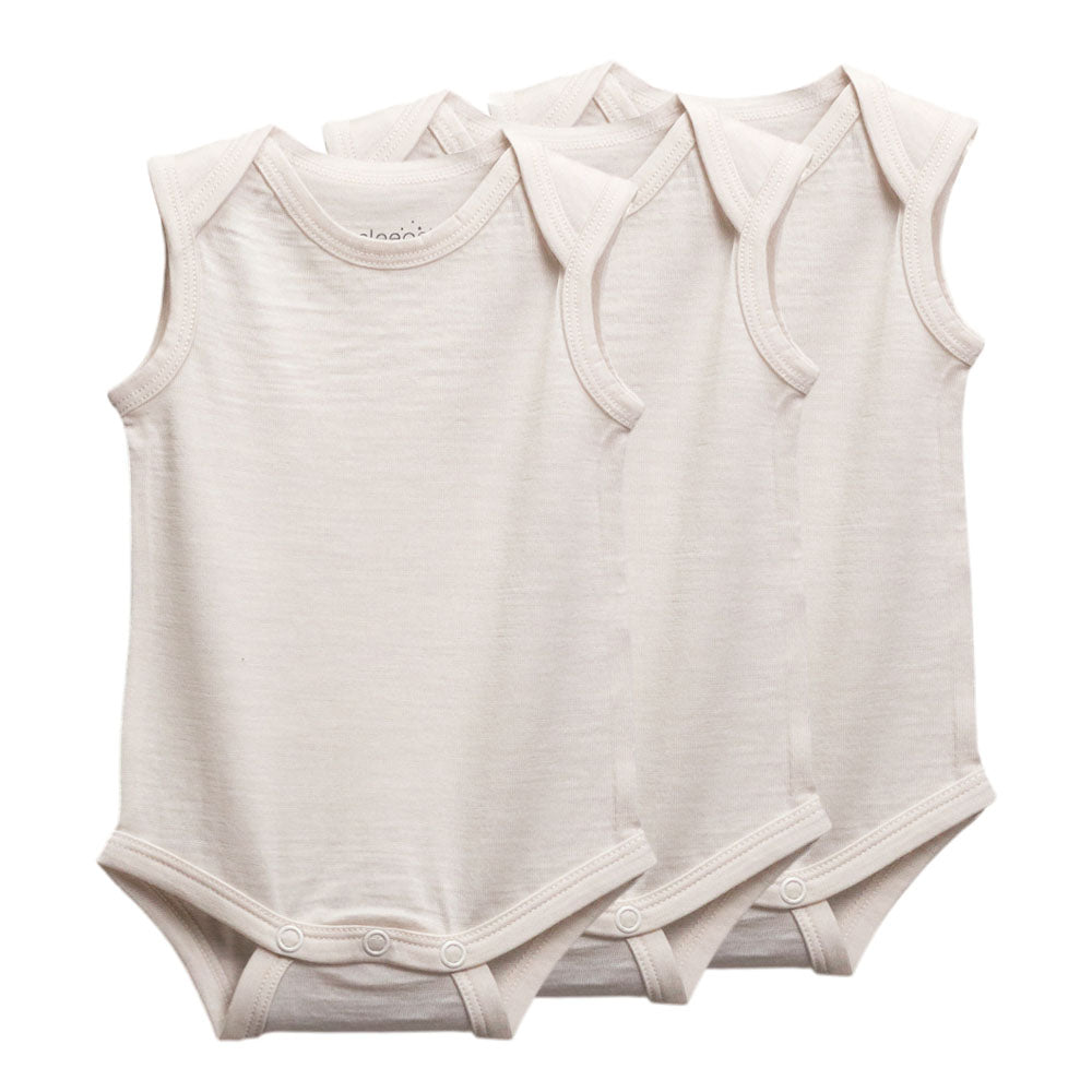 Three sleeveless baby bodysuits in a soft off-white/cream color, arranged overlapping on a plain white background.