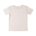 A white short-sleeve crewneck t-shirt, laid flat against a solid white background. The inner neck label shows the brand name The Sleep Store