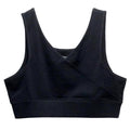 A black sleep bra with a crossover wrap front and wide shoulder straps, shown flat on a white background. The brand name The Sleep Store is printed inside the neckline.