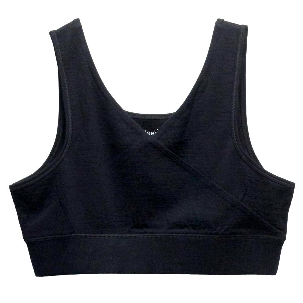 A black sleep bra with a crossover wrap front and wide shoulder straps, shown flat on a white background. The brand name The Sleep Store is printed inside the neckline.