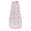 A sleeveless cotton baby sleep sack with a repeating floral snowflake pattern in pink, purple, and blue on a white background, shown flat against a white background.