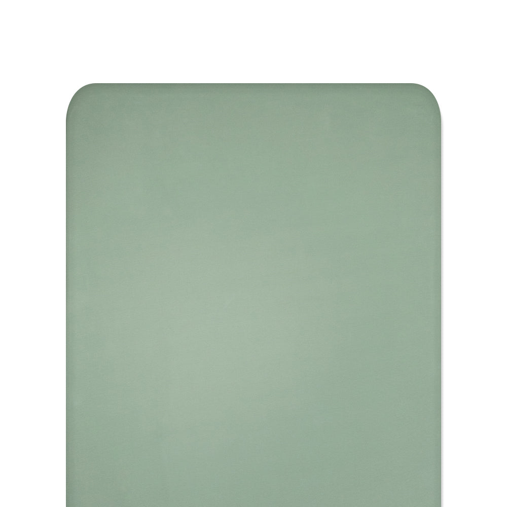 Green fitted sheet on white background