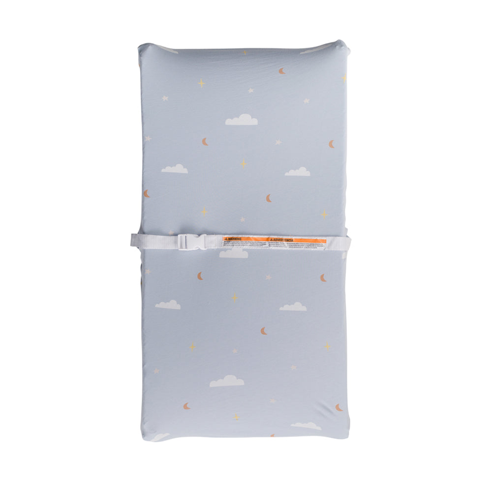 Blue baby changing mat with cloud and moon pattern on a white background
