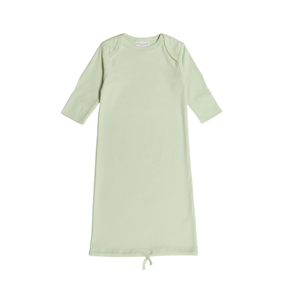 Light green cotton baby gown with envelope neck on a white background