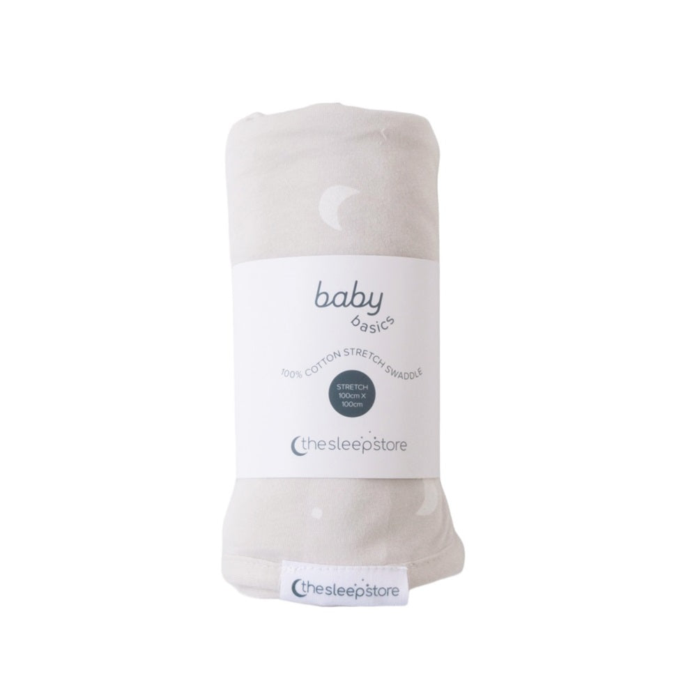 Folded baby swaddle blanket with 'baby basics' label on a white background