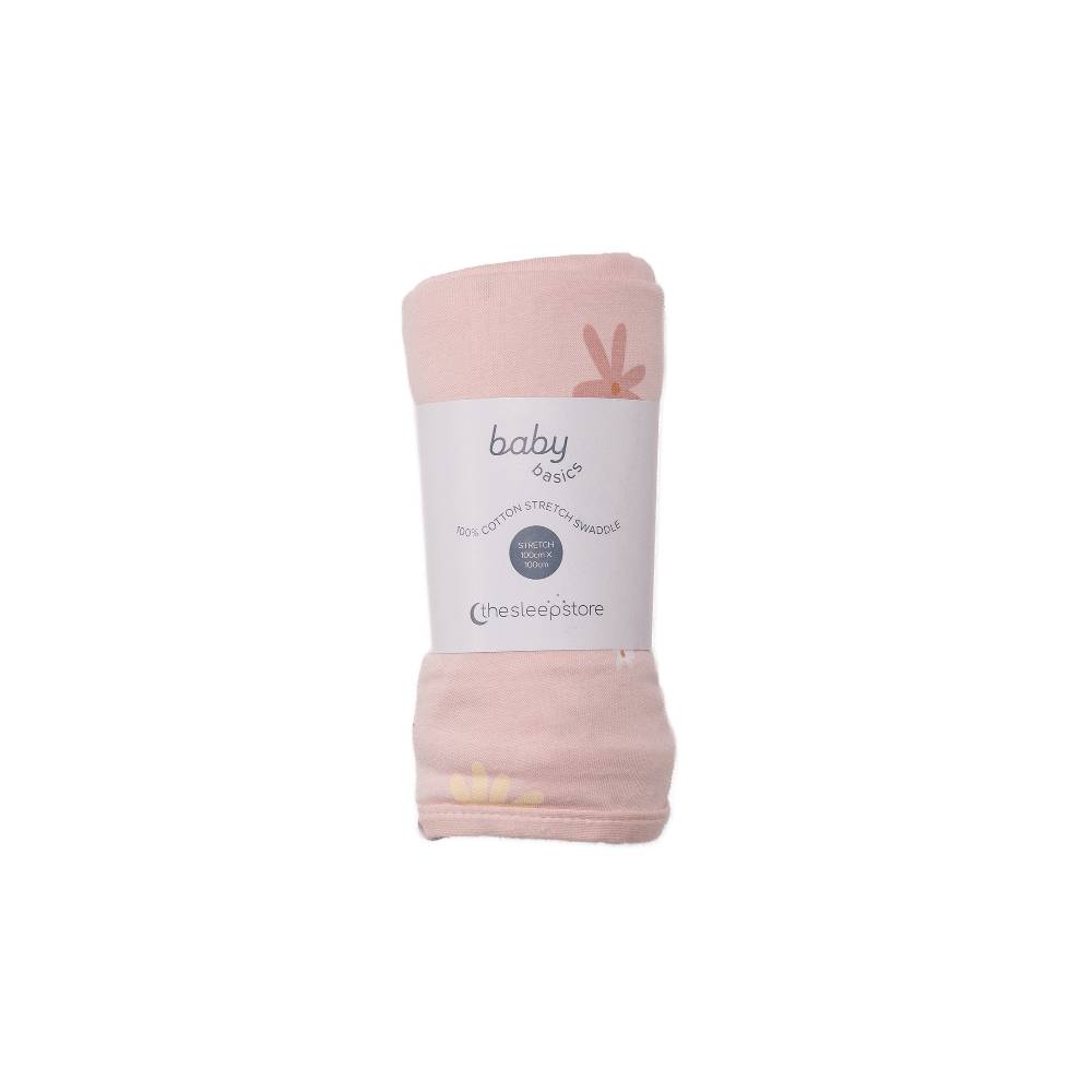 Pink baby swaddle blanket with a label on a white background