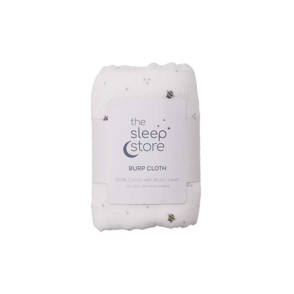 White burp cloth with bees and 'the sleep store' branding on a white background