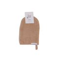 Oat bath mitt with a label on a white background