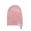 Pink bath mitt with a label on a white background