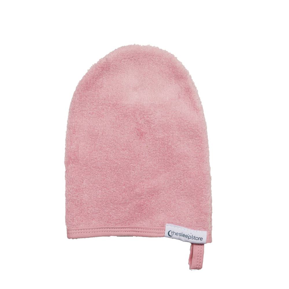 Pink bath mitt with a label on a white background