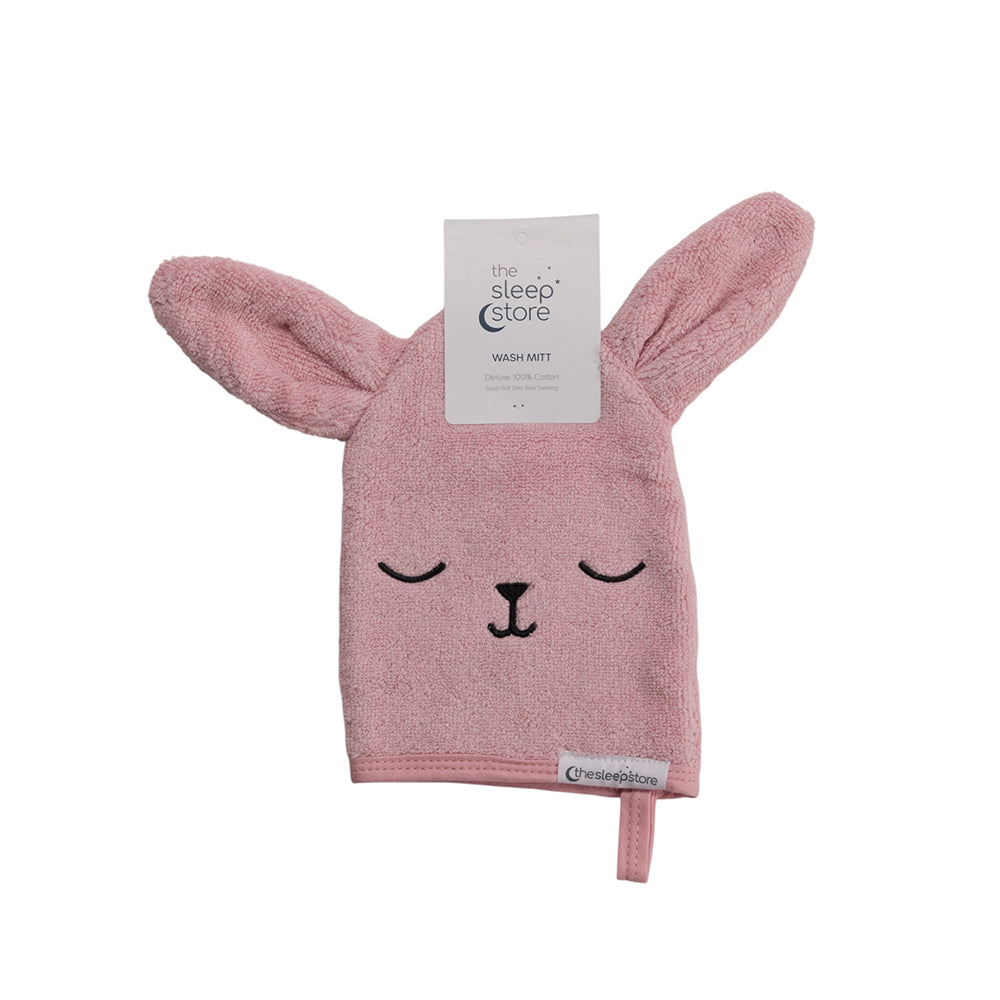 Pink rabbit-shaped wash mitt with a visible brand tag on a white background