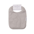 Gray towelling classic baby bib with a label on a white background