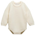 Cream-colored knitted merino wool baby bubblesuit romper on a white background