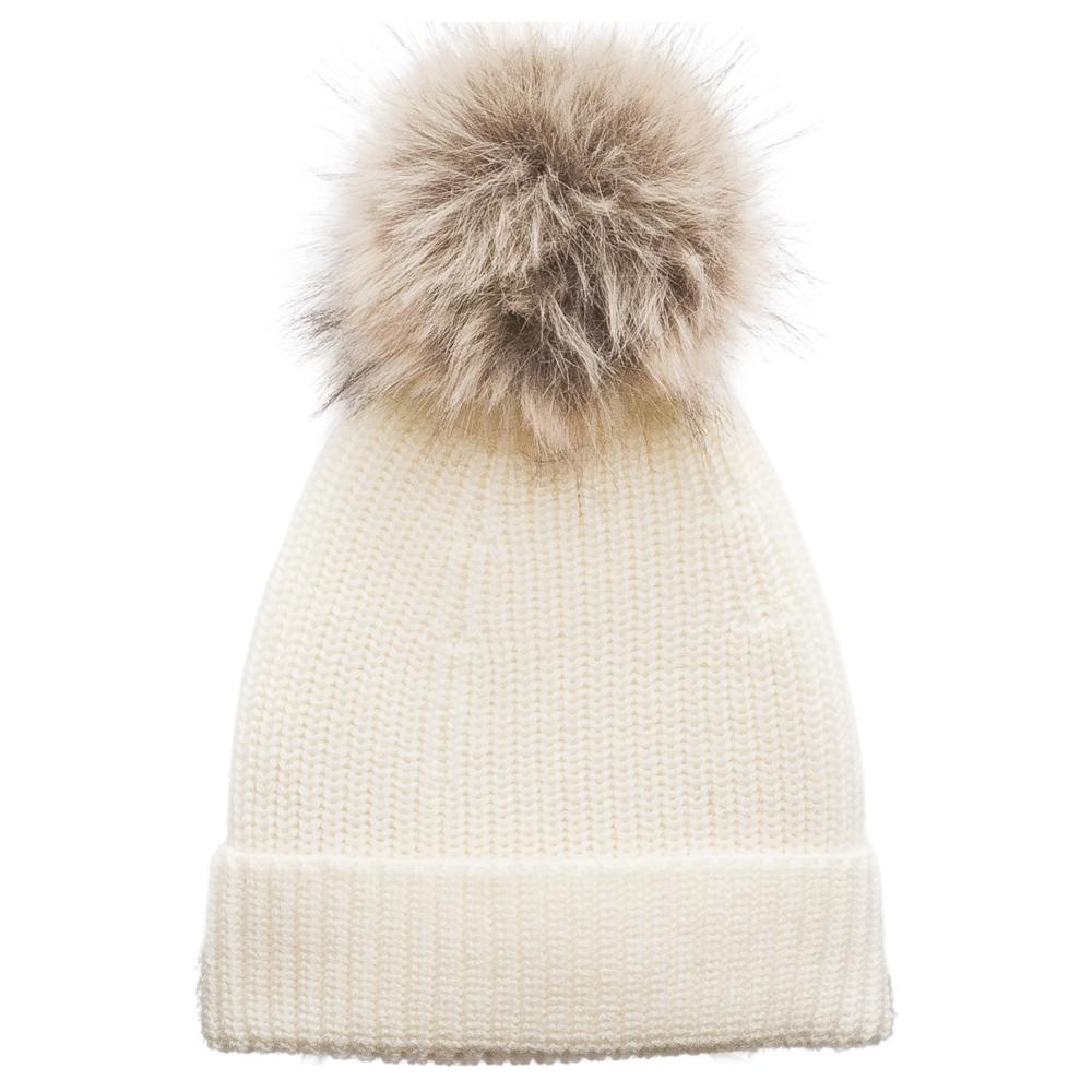 White merino wool knit beanie with a fur pom-pom on a white background