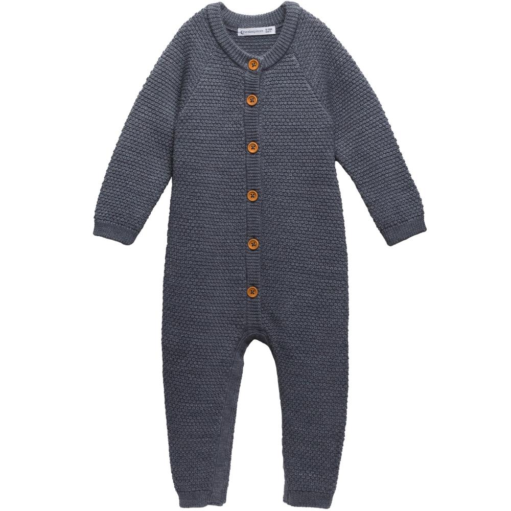 Grey merino wool knitted baby romper with brown button details on a white background
