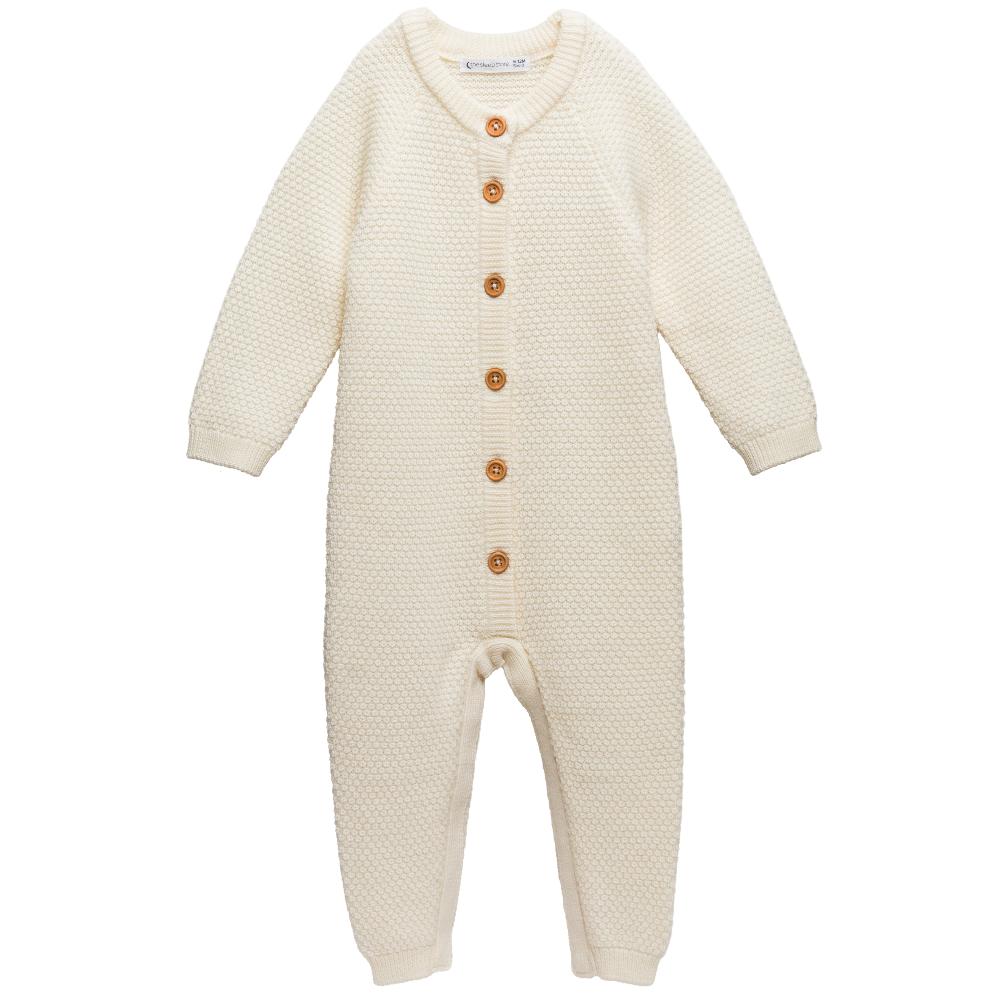 Cream merino wool Knitted baby onesie with button details on a white background