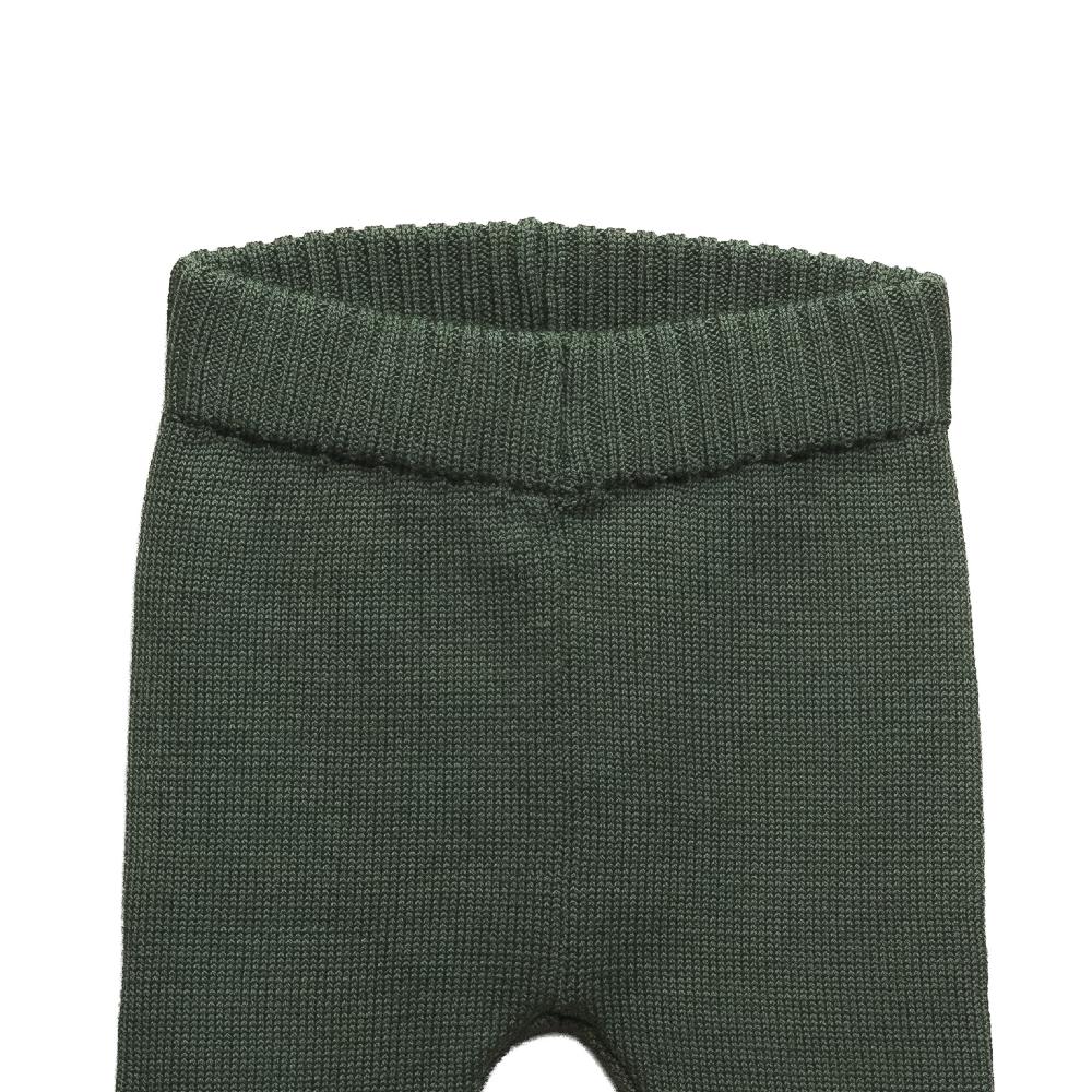 Green baby leggings with a ribbed waistband on a white background