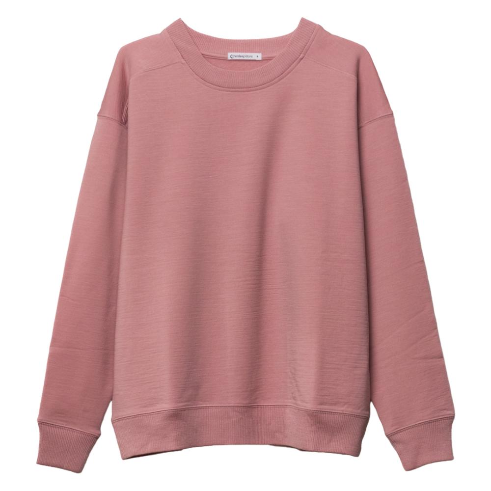 A dusty rose merino fleece crewneck sweatshirt with long sleeves and ribbed cuffs and hem, shown flat against a plain white background.