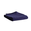 A folded dark navy blue merino fleece/tencel blanket with ribbed edges, shown on a plain white background.