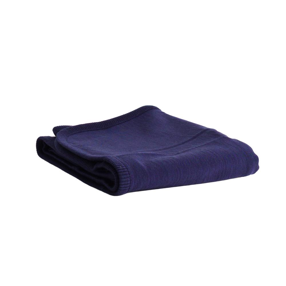 A folded dark navy blue merino fleece/tencel blanket with ribbed edges, shown on a plain white background.