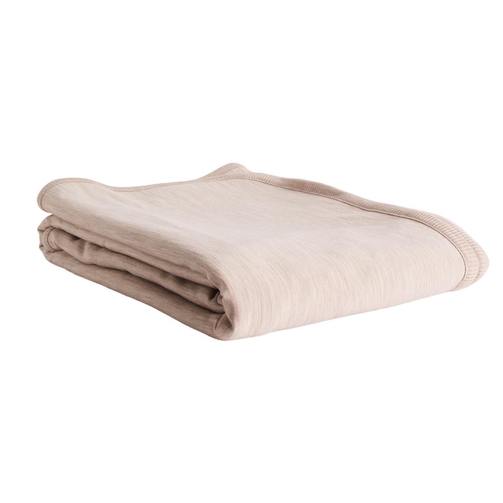 A folded light beige merino fleece blanket with a ribbed border, shown on a plain white background.