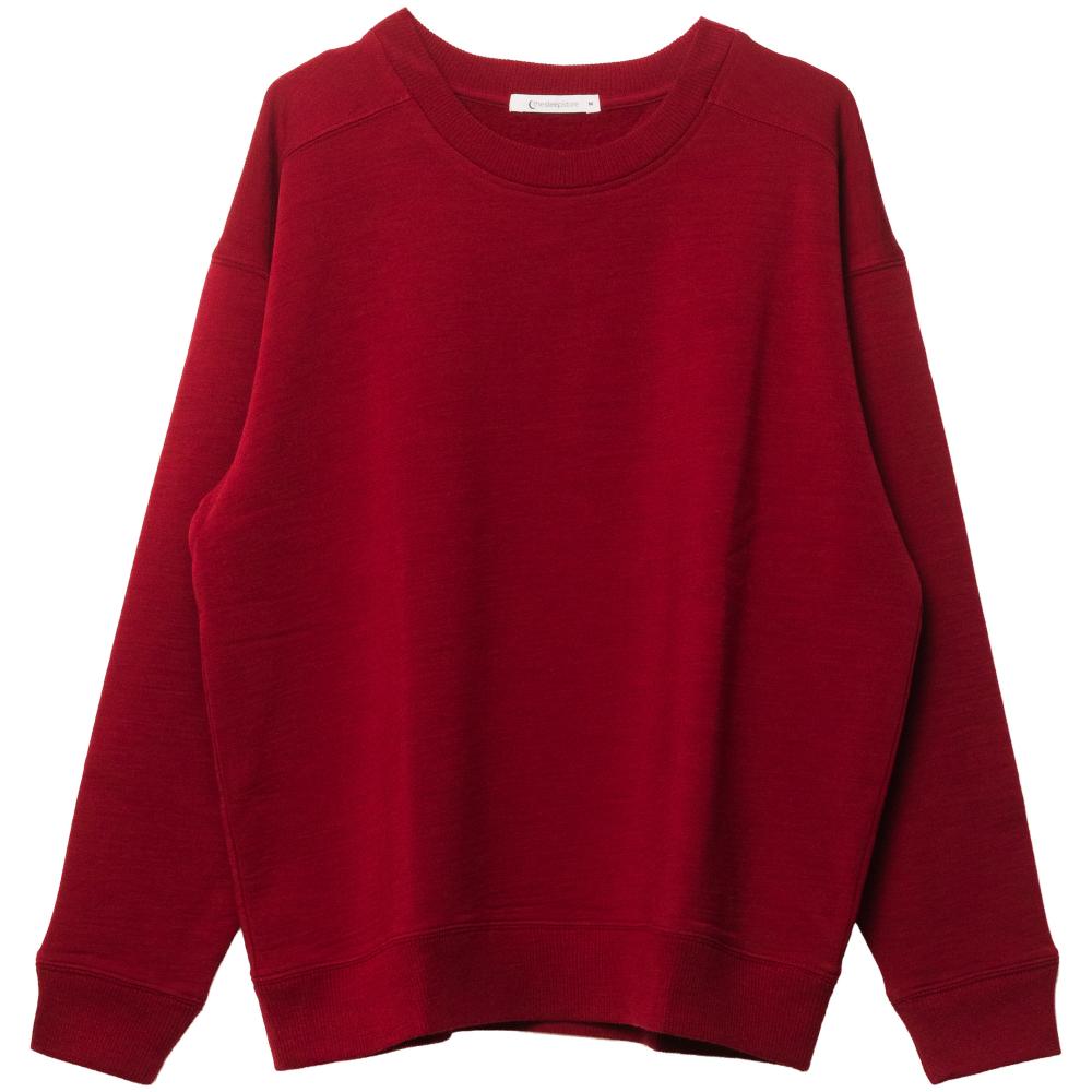 A solid deep red merino fleece crewneck sweatshirt with long sleeves and ribbed cuffs and hem, shown flat against a plain white background.