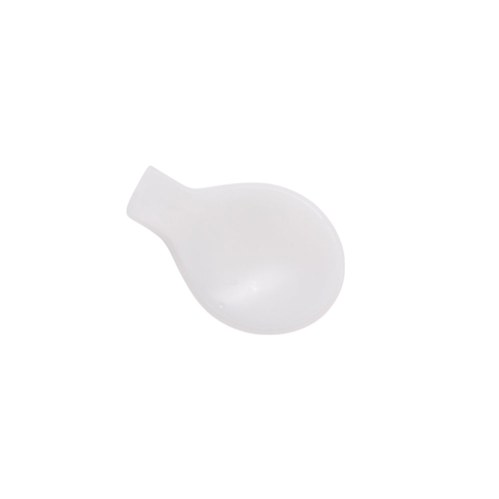 White plastic spoon shaped item on a white background 