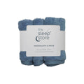 Three blue cotton terry washcloths in a package with 'The Sleep Store' label on a white background