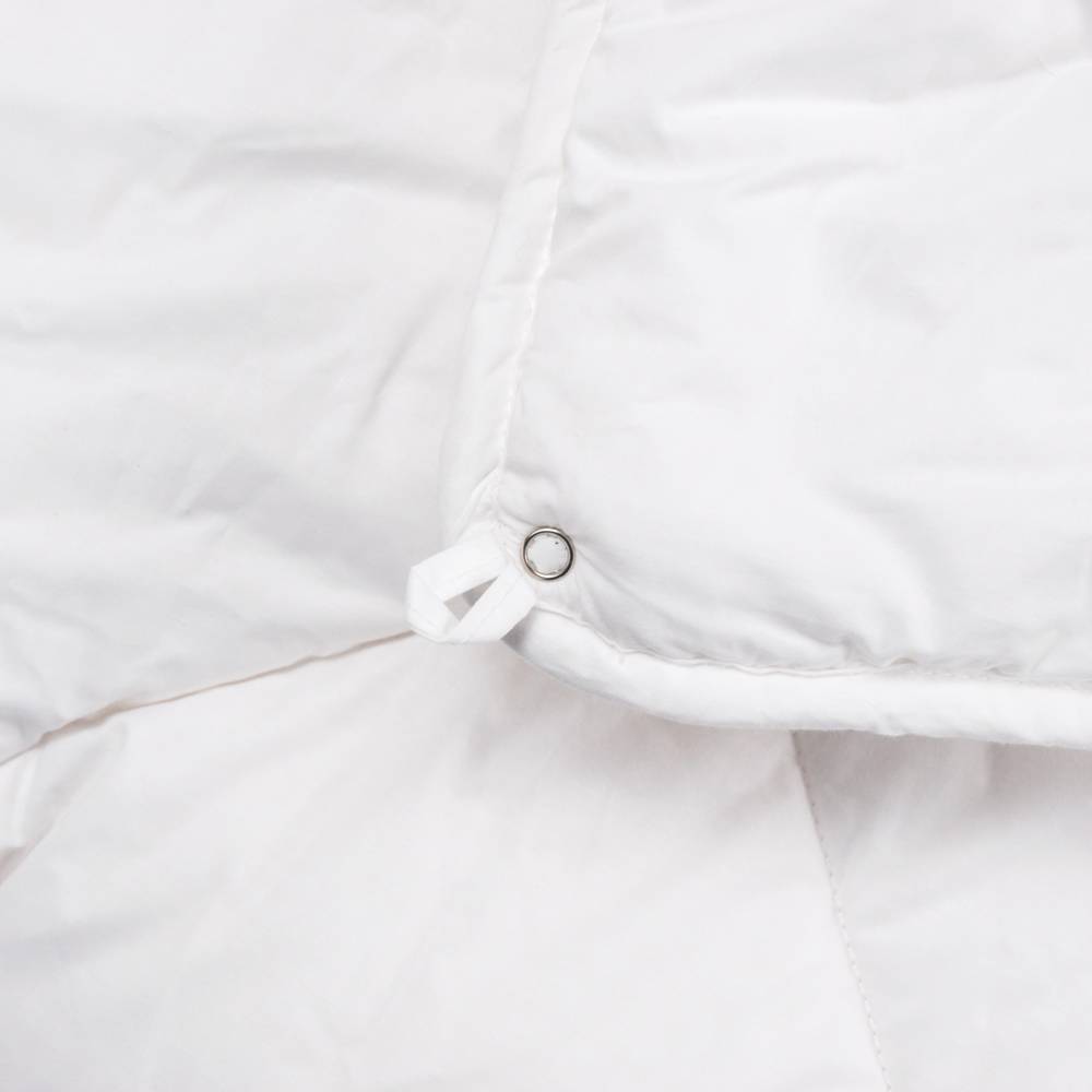 White Duvet Inner rolled up on a white background