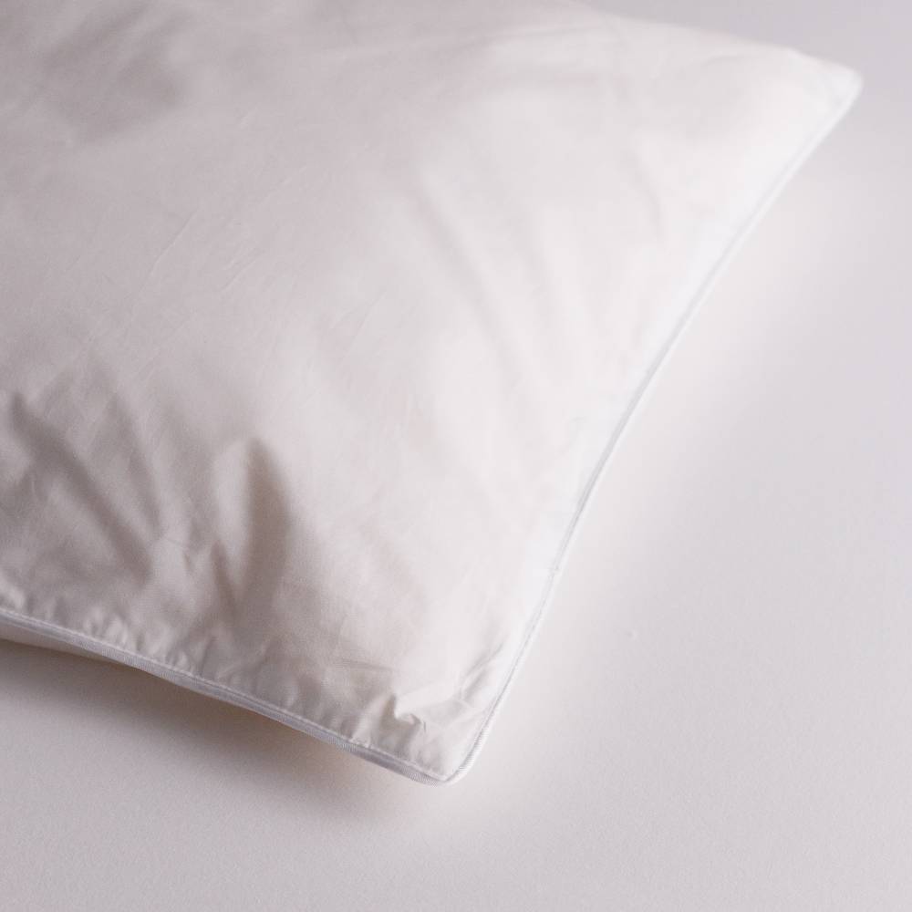 White wool kids pillow on a light gray background